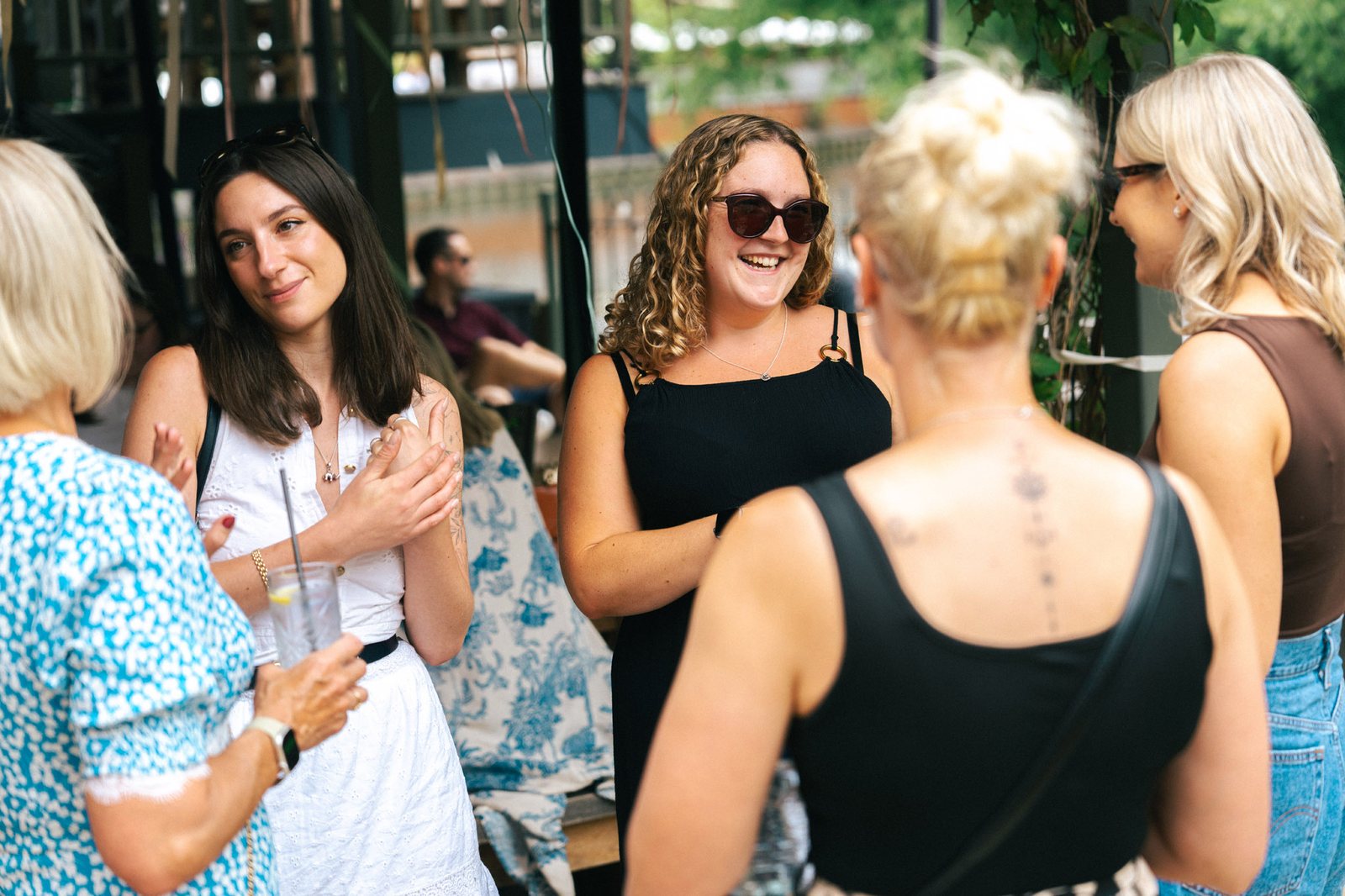 Guests laughing at the Advance TRS summer party