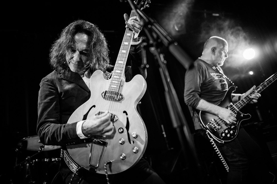 Guitarist on stage at the West End Centre, black and white